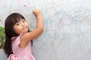 girl coloring crayons on walls - wallpaper wallcovering